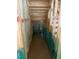Unfinished hallway showing exposed framing, insulation, stairs, and the doorway to another room at 456 Golden Dragonfly St, Wake Forest, NC 27587