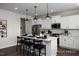 Beautiful kitchen featuring an island with pendant lights, stainless steel appliances, and white cabinetry at 456 Golden Dragonfly St, Wake Forest, NC 27587
