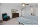 Cozy main bedroom showcasing a dresser with mirror and comfortable seating area at 456 Golden Dragonfly St, Wake Forest, NC 27587