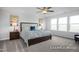 Bright main bedroom featuring large windows, soft carpet, and modern decor at 456 Golden Dragonfly St, Wake Forest, NC 27587