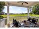 Covered back porch with outdoor seating, a ceiling fan, and an open view at 456 Golden Dragonfly St, Wake Forest, NC 27587