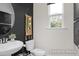 Contemporary powder room featuring a pedestal sink, a neutral color scheme, and modern decor at 456 Golden Dragonfly St, Wake Forest, NC 27587