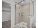 Shower with tiled walls and a built-in bench seat at 456 Golden Dragonfly St, Wake Forest, NC 27587