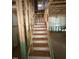 Unfinished wooden staircase ready for your personal touch and customization, leading to endless possibilities at 456 Golden Dragonfly St, Wake Forest, NC 27587