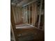 View of an unfinished room with exposed framing, plumbing and flooring, ready for customization and personalization at 456 Golden Dragonfly St, Wake Forest, NC 27587