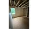 Unfinished room with exposed framing and window; offers a blank canvas for creating your dream space at 456 Golden Dragonfly St, Wake Forest, NC 27587