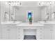 Double vanity bathroom showcasing granite counters and large mirrors for a luxurious touch at 4817 Fox Branch Ct, Raleigh, NC 27614