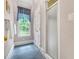 Bathroom featuring a shower with a frosted glass door, and a window offering natural light at 4817 Fox Branch Ct, Raleigh, NC 27614