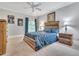 Inviting bedroom with a decorative headboard, blue accents and a ceiling fan at 4817 Fox Branch Ct, Raleigh, NC 27614