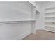 Walk-in closet offering ample storage space with shelving and rods for organized clothing at 4817 Fox Branch Ct, Raleigh, NC 27614