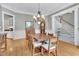 Traditional dining room with hardwood floors, chandelier, and direct access to the grand foyer at 4817 Fox Branch Ct, Raleigh, NC 27614