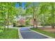 Beautiful brick home with a circular driveway and lush landscaping at 4817 Fox Branch Ct, Raleigh, NC 27614