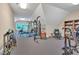 Home gym featuring multiple machines, free weights, a weight bench and a punching bag for fitness enthusiasts at 4817 Fox Branch Ct, Raleigh, NC 27614