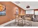 Home theater featuring comfortable seating, a projector screen, and a bar area at 4817 Fox Branch Ct, Raleigh, NC 27614