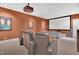Home theater with a projector screen, comfortable seating, and movie posters for the ultimate viewing experience at 4817 Fox Branch Ct, Raleigh, NC 27614