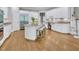 Bright kitchen features granite countertops, a stainless steel refrigerator, and a center island with seating at 4817 Fox Branch Ct, Raleigh, NC 27614