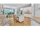 Open kitchen with island, granite counters, stainless appliances, and views into breakfast area at 4817 Fox Branch Ct, Raleigh, NC 27614