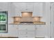 Gourmet kitchen boasts granite countertops, a tiled backsplash, and stainless steel appliances at 4817 Fox Branch Ct, Raleigh, NC 27614