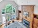 Open living room featuring fireplace with built-ins and many windows at 4817 Fox Branch Ct, Raleigh, NC 27614
