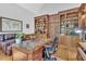 Spacious home office with hardwood floors, custom wood desk and built-in bookshelves at 4817 Fox Branch Ct, Raleigh, NC 27614