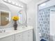 Contemporary bathroom featuring dual sinks, modern fixtures, and stylish decor at 5720 Brushy Meadows Dr, Fuquay Varina, NC 27526