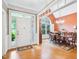 Elegant dining room with hardwood floors, a chandelier, and a large window at 5720 Brushy Meadows Dr, Fuquay Varina, NC 27526