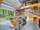 Spacious garage workshop featuring a variety of tools, work benches, and ample storage at 5720 Brushy Meadows Dr, Fuquay Varina, NC 27526