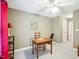 Versatile home office space with neutral walls, a simple desk, and ample natural light at 5720 Brushy Meadows Dr, Fuquay Varina, NC 27526