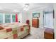 Spacious main bedroom with sitting area, soft lighting, wooden furniture and tray ceiling at 5720 Brushy Meadows Dr, Fuquay Varina, NC 27526