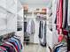 Organized walk-in closet with shelving, hanging rods, drawers, and compartments for storage and organization at 5720 Brushy Meadows Dr, Fuquay Varina, NC 27526