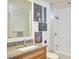Cozy bathroom featuring granite counters, a bathtub with shower, and updated fixtures at 601 W Rosemary St # 712, Chapel Hill, NC 27516