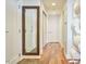Bright hallway features hardwood floors and a large decorative mirror at 601 W Rosemary St # 712, Chapel Hill, NC 27516