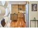 Cozy kitchen featuring wooden cabinetry, stainless steel appliances, and an island with stone countertop at 601 W Rosemary St # 712, Chapel Hill, NC 27516