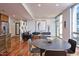 Open living space with hardwood floors, modern decor, and ample natural light from large windows at 601 W Rosemary St # 712, Chapel Hill, NC 27516