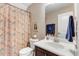 Hall bathroom featuring a shower/tub combo, vanity, and toilet at 62 Jubilee Ct, Clayton, NC 27527
