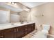 Bathroom featuring a double sink, vanity, and toilet at 62 Jubilee Ct, Clayton, NC 27527