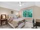 Spacious bedroom featuring a full bed, ceiling fan, and natural light at 62 Jubilee Ct, Clayton, NC 27527