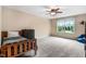 Cozy bedroom with a large window providing natural light and a simple decor at 62 Jubilee Ct, Clayton, NC 27527