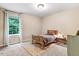 Neutral bedroom with a twin bed, carpet, and a window with lots of natural light at 62 Jubilee Ct, Clayton, NC 27527
