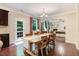 Inviting dining room with hardwood floors, a wooden table, and ample natural light at 62 Jubilee Ct, Clayton, NC 27527