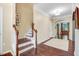 Elegant foyer with hardwood floors, staircase, and an arched doorway leading to other rooms at 62 Jubilee Ct, Clayton, NC 27527