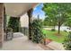 Charming covered front porch with beautiful landscaping and classic architectural details at 62 Jubilee Ct, Clayton, NC 27527