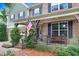 Inviting covered front porch with brick and stone details, perfect for relaxing outdoors at 62 Jubilee Ct, Clayton, NC 27527