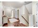 Bright hallway with hardwood floors and neutral colors, providing access to multiple rooms at 62 Jubilee Ct, Clayton, NC 27527