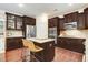 Modern kitchen with stainless steel appliances, a granite island, and abundant cabinet space at 62 Jubilee Ct, Clayton, NC 27527