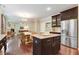 Open kitchen concept, flowing into the dining and living areas, featuring stainless appliances at 62 Jubilee Ct, Clayton, NC 27527
