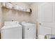 Bright laundry room featuring a washing machine and dryer at 62 Jubilee Ct, Clayton, NC 27527