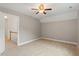 Spacious carpeted bedroom featuring a ceiling fan and neutral paint, ready for personalization at 6335 Cedar Waters Dr, Raleigh, NC 27607