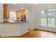 This open-concept kitchen features stainless steel appliances and lots of windows at 6335 Cedar Waters Dr, Raleigh, NC 27607