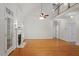 Spacious living room with lots of natural light, a fireplace, and beautiful hardwood floors at 6335 Cedar Waters Dr, Raleigh, NC 27607